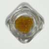 A top-down view of a glass jar containing 5 grams of golden House Live Resin, showing its crystalline, amber-colored texture on a white background.