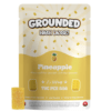 Grounded 500mg THC Brick - Pineapple, featuring vibrant packaging and a pineapple-flavored edible for cannabis enthusiasts.