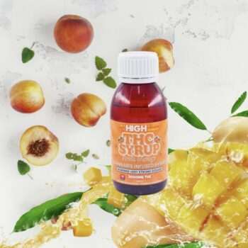Sky High Edibles THC Syrup – Peach Mango 3000mg bottle surrounded by fresh peaches and mango slices for same-day delivery in the Fraser Valley.