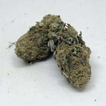 Grape Ape AA indica cannabis flower buds, dark purple-tinged nugs with frosty trichomes, THC 16-19%