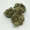 White Widow AA hybrid cannabis flower buds, frosty light-green nugs with orange pistils, THC 16-19%